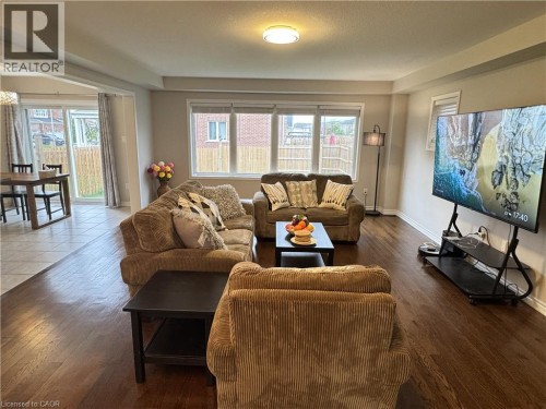 Hardwood-finish flooring, recessed lighting, and a large window providing natural illumination - 67 Pointer Street, Cambridge, ON 