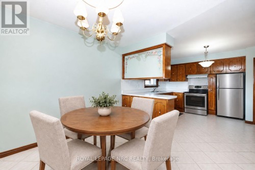 Virtually staged kitchen and dining room - 38 Rivercrest Road, Hamilton (Riverdale), ON 
