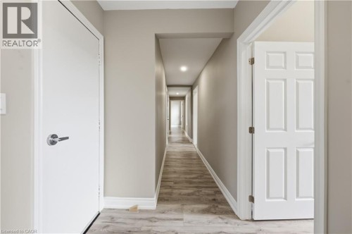 Hallway featuring wood-finish flooring, recessed lighting, and neutral wall tones - 98 Duke Street Unit# 2Nd, Hamilton, ON 
