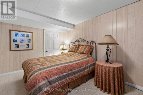 lower level den currently set up with a bed. - 217 Bethune Crescent, Goderich (Goderich (Town)), ON 
