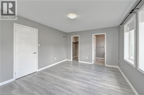 Wood-finish flooring with light gray walls - 103 Blackbird Circle, Cambridge, ON 