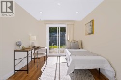 Recessed ceiling lighting, wood-finish flooring, sliding glass door, and a private outdoor space - 