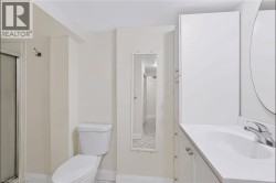 Vanity with an integrated sink, polished chrome faucet, and white cabinetry - 