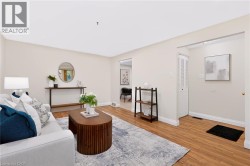 Light-toned walls, wood-finish flooring, and white trim create a bright atmosphere - 