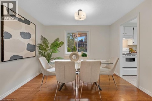 Wood-finish flooring throughout, with a single window providing natural illumination - 7 Underhill Crescent, Kitchener, ON 