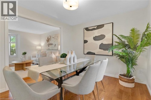 Hardwood flooring throughout, recessed ceiling lighting, and a wide cased opening - 7 Underhill Crescent, Kitchener, ON 