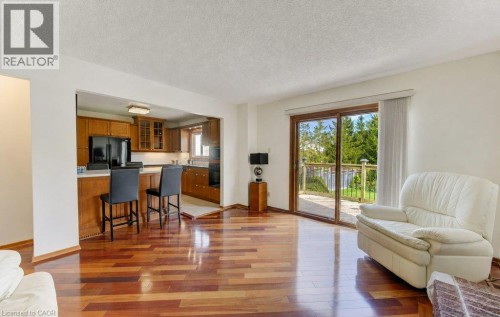 Gleaming Brazilian Cherry hardwood floor and sliders to deck - 238 Mcgarry Drive, Kitchener, ON 