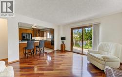 Gleaming Brazilian Cherry hardwood floor and sliders to deck - 