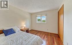Tidy 3rd bedroom with gleaming Cherry hardwood floors - 