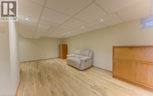 Recessed lighting, light wood-finish flooring, drop ceiling, and a high-set window - 238 Mcgarry Drive, Kitchener, ON 