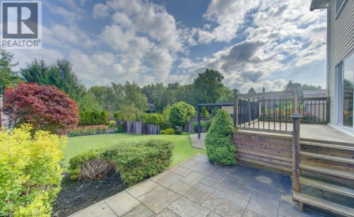 Great backyard for entertaining with two patios and a deck - 238 Mcgarry Drive, Kitchener, ON 
