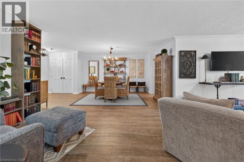 Open-concept living space featuring wood-finish flooring throughout - 1237 North Shore Boulevard Unit# 405, Burlington, ON 