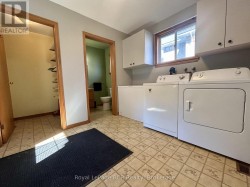 Main Floor Laundry, 2-Pc Bath, & Storage - 