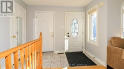 Garage entry provides weather-protected access. - 