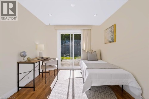 Recessed ceiling lighting, wood-finish flooring, sliding glass door, and a private outdoor space - 95 Underhill Crescent, Kitchener, ON 