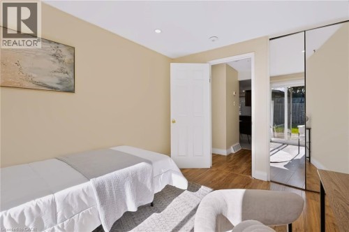 Recessed lighting, wood-finish flooring, and mirrored closet doors - 95 Underhill Crescent, Kitchener, ON 