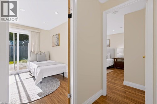 Recessed lighting illuminates wood-finish flooring throughout - 95 Underhill Crescent, Kitchener, ON 