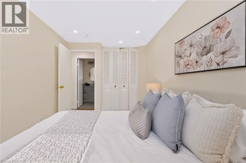 Recessed ceiling lighting, louvered bi-fold doors, and a neutral color palette - 95 Underhill Crescent, Kitchener, ON 