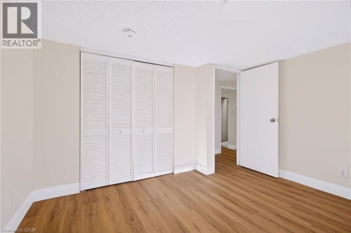 Wood-finish flooring throughout the room - 95 Underhill Crescent, Kitchener, ON 