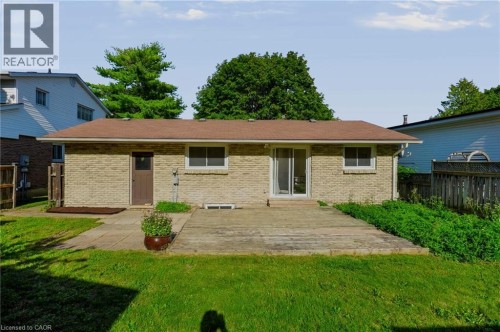 Brick exterior with a brown roof and a sliding glass door - 95 Underhill Crescent, Kitchener, ON 