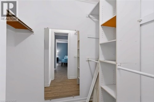 Built-in custom closet system with adjustable shelving and hanging rods - 121 University Avenue E Unit# 102, Waterloo, ON 