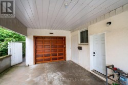 Secondary suite entrance under covered car-port - 