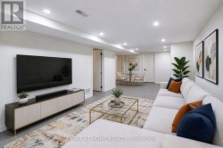 *virtually staged* Lower suite - living room - 