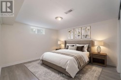 *virtually staged* Lower suite - Primary bedroom - 