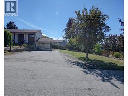 carport and storage shed behind and lots of parking and yard area - 