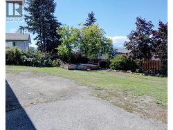 Side yard of home, lots of space for yard area. - 