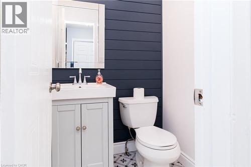 White vanity with cabinet storage, vessel sink, and silver-finish faucet - 543 Drummerhill Crescent, Waterloo, ON 