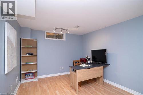 Recessed window with white trim, track lighting, light wood-finish flooring, and light blue wall paint - 543 Drummerhill Crescent, Waterloo, ON 