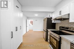 Updated kitchen with sleek modern finishes - 