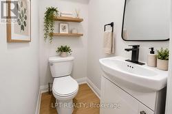 Virtually staged powder room with modern finishes - 