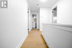 Bright upper hallway with Vinyl flooring - 