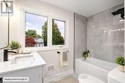 Virtually staged beautifully updated bathroom - 