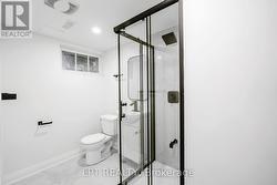 Updated lower-level bathroom with glass shower - 