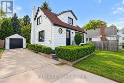 Exterior with driveway and detached garage - 