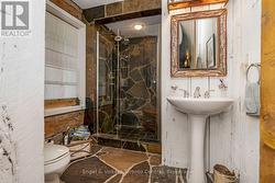 Main floor washroom with tiled shower - 