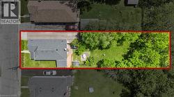 Single-story residence with a gabled roof and a paved driveway - 