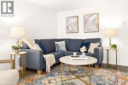White walls, wood-finish flooring, and recessed lighting - 