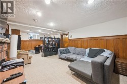 Carpeted flooring paired with wood paneling - 