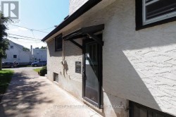 Side Entrance to Kitchen and Basement Staircase - 