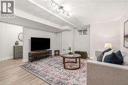 Finished lower level featuring recessed lighting and wood-finish flooring - 
