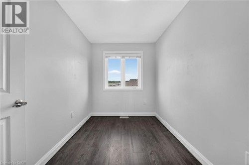 Wood-finish flooring, white walls, and a window with white trim - 1169 E Garner Road E Unit# 66, Ancaster, ON 