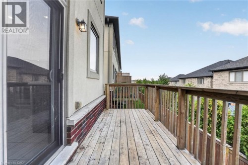 Wood-plank outdoor deck with natural wood railing - 1169 E Garner Road E Unit# 66, Ancaster, ON 