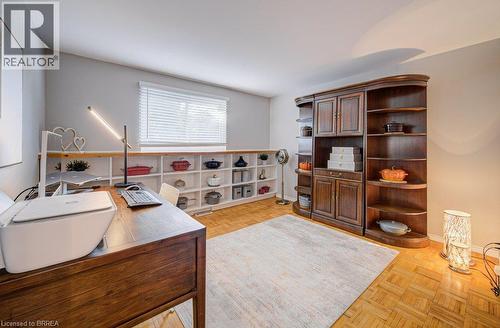 Light-toned walls complement wood-finish flooring - 3158 Palmer Drive, Burlington, ON 