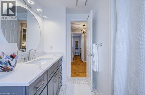 White countertop with an undermount sink and brushed nickel faucet - 3158 Palmer Drive, Burlington, ON 