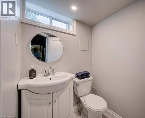 Vanity with cabinet storage, chrome faucet, and integrated sink - 3158 Palmer Drive, Burlington, ON 