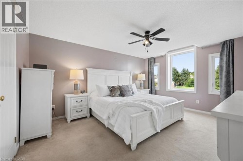 Recessed lighting, ceiling fan with light fixture, multiple windows, and light-colored carpeting - 67 Apple Tree Drive, Kitchener, ON 